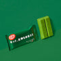 Japanese Kit Kat: Rich Green Tea bar by Nestle Japan partially unwrapped with a piece broken off, on a matching green background. thumbnail 2