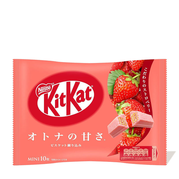 Package of Japanese Kit Kat: Strawberry Otona no Amasa with image of strawberries and broken chocolate pieces on a red background. Text includes Japanese characters and the Nestle Japan logo.