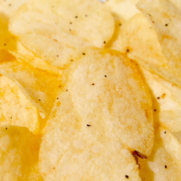 A pile of Lay's Potato Chips: Rib Eye Steak with Black Truffle on a plate.