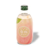 A bottle of Tomomasu Rich White Peach Sparkling Soda with a leaf on it.
