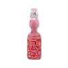 The image features a Hata Ramune Soda: Strawberry (6.76 oz) bottle. The packaging is pink with illustrations of strawberries and Japanese text. It has a traditional marble-sealed glass bottle, a signature design of Ramune soda, which adds a fun and interactive experience when opening. Brand: Bokksu Market; Product: Hata Ramune Soda: Strawberry (6.76 oz).