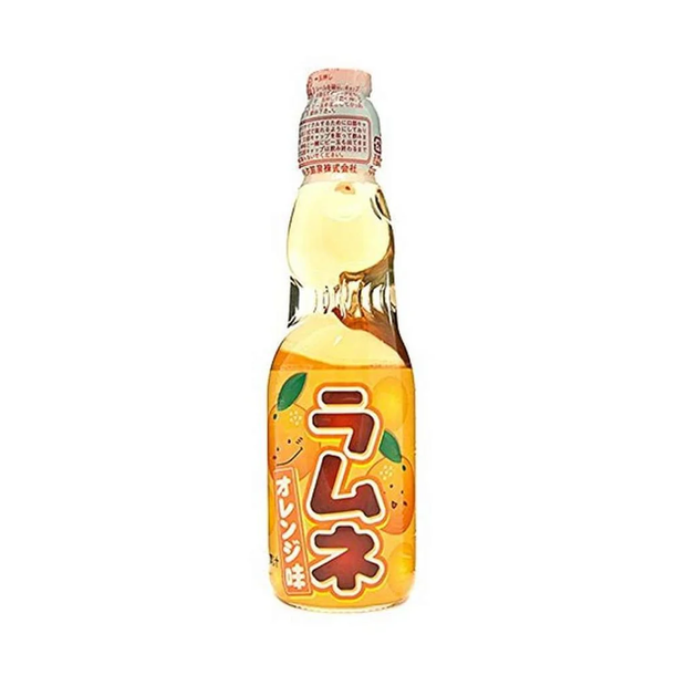 The image features a Hata Ramune Soda: Orange (6.76 oz) bottle. The packaging is vibrant orange, decorated with citrus illustrations that highlight its refreshing orange flavor. This carbonated Japanese soda is housed in a traditional marble-sealed glass bottle, creating a fun, nostalgic drinking experience. Brand: Bokksu Market; Product: Hata Ramune Soda: Orange (6.76 oz).