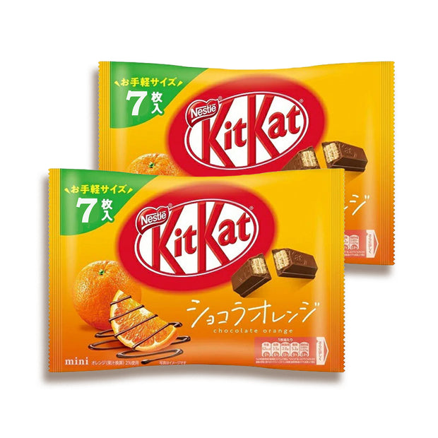 Two Nestle Japan Japanese Kit Kat: Chocolate Orange (2-Pack) packages, featuring Japanese text, combine the rich taste of chocolate with zesty citrus flavors.