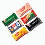 Assorted Nestle Japan Kit Kat bars in different flavors and packaging designs, including green tea and classic chocolate, arranged on a white background. thumbnail 5