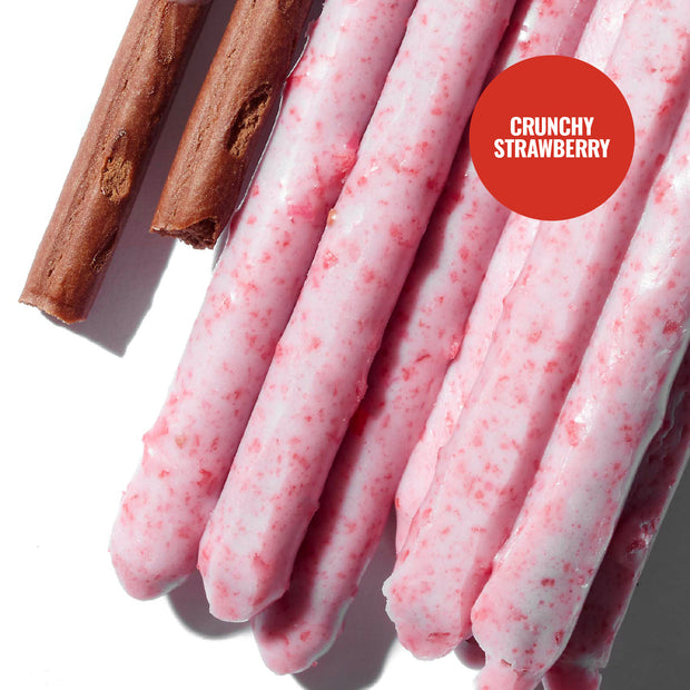 Glico Pocky: Variety Pack (6-Pack) by Glico features pink, strawberry-coated biscuit sticks and a chocolate-coated stick marked "Crunchy Strawberry" on a red circle—an irresistible treat for snack lovers.