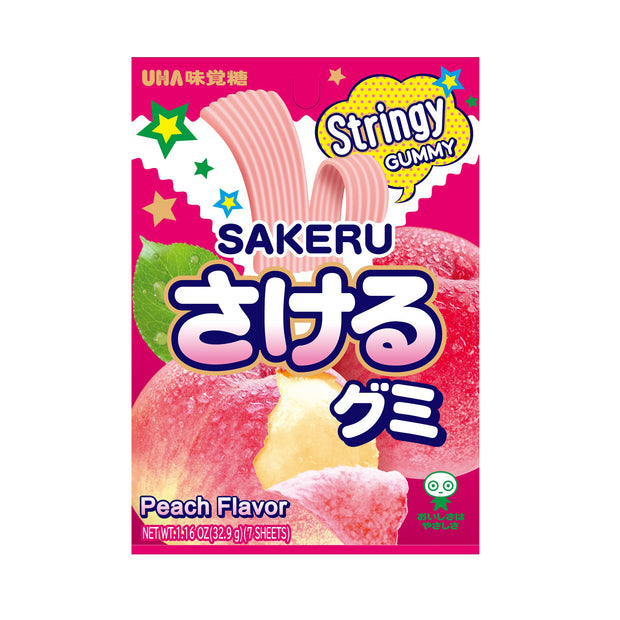 The packaging of Uha Mikakuto's Uha Sakeru Gummy: White Peach (7 pieces) features vibrant graphics and appealing peach illustrations, with Japanese text emphasizing the enjoyable peel strips inside.