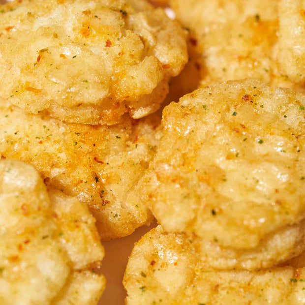A close up of a plate of Amanoya Himemaru Rice Crackers: Original.
