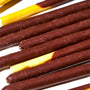 Close-up view of Glico Pocky: Chocolate, Japanese snack biscuit sticks dipped in chocolate, arranged in parallel rows. thumbnail 2