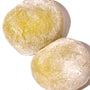 A white background with two Kubota Daifuku Mochi: Matcha Green Tea balls on it. thumbnail 2