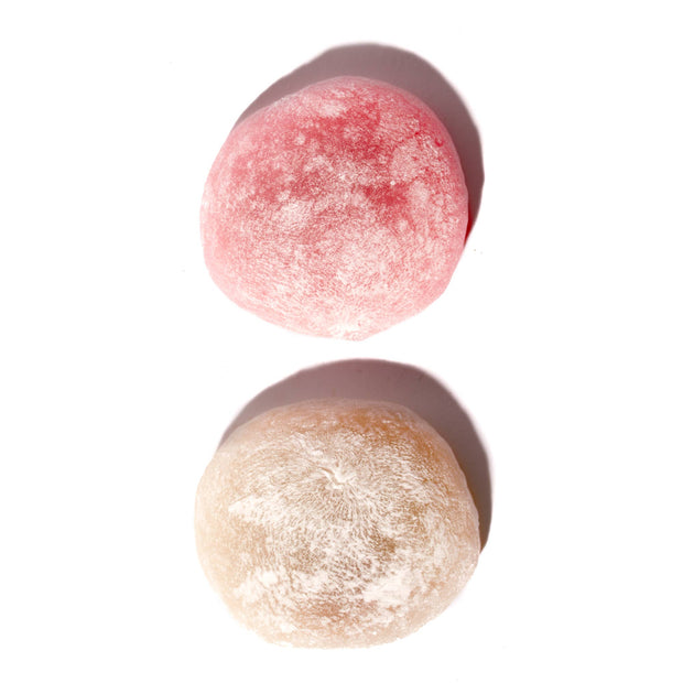 Two Kubota Daifuku Mochi: Kouhaku Ogura Red Bean on a white surface.