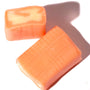 Two pieces of UHA Mikakuto Puchao Gummy Candy: Mango on a white surface. thumbnail 3