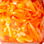 An Oriental Mascot jar of pickled bamboo shoot in chili oil on a white background. thumbnail 2