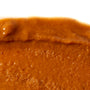 A brown sauce made with Onetang Organic Sesame Paste on a white plate. thumbnail 3
