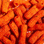 A pile of Cosmos Tteokbokki Rice Cake Chips on a white surface. thumbnail 3
