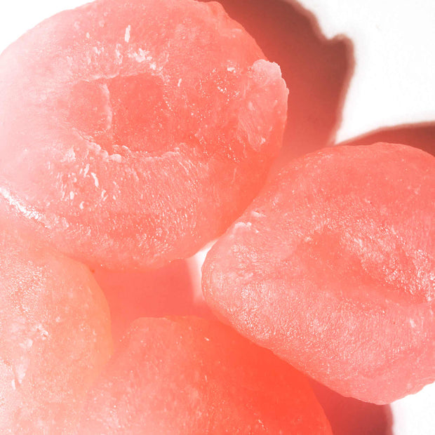 A bunch of Seiki One-Bite Mochi: White Peach on a white surface.