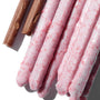A group of Glico Pocky: Crunchy Strawberry sticks on a white surface. thumbnail 2