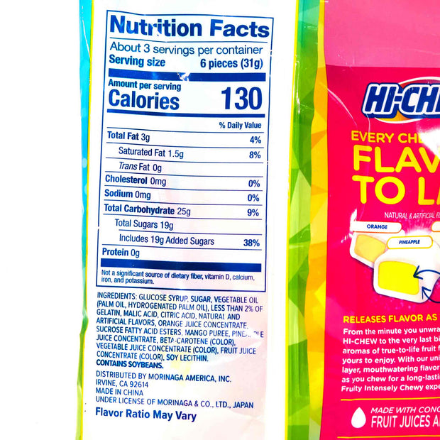 A package of Morinaga Hi-Chew: Tropical Mix next to a bag of ketchup.