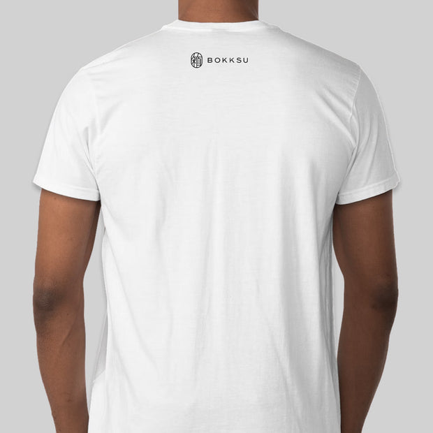 Man wearing a white Bokksu T-shirt: Sakura with the "New York Katakana" logo on the back.