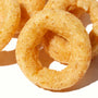 A group of Calbee onion rings on a white surface. thumbnail 2
