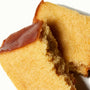 A slice of Sakura Castella Cake: White Peach (3 pieces) on a white plate. thumbnail 2