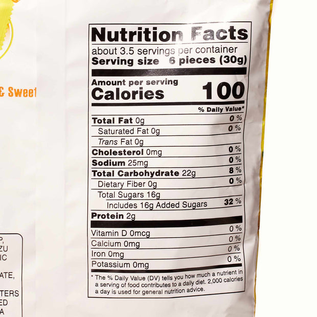 A close-up of a nutrition facts label on a pack of refreshing summery treat Kasugai Frutia Yuzu Gummy by Kasugai, showing 100 calories per serving, 0g total fat, 0mg cholesterol, 55mg sodium, 22g total carbohydrates, 16g total sugars, and 2g protein.