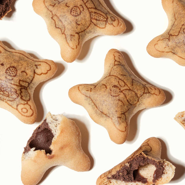 A group of Japanese sweets with Lotte Koala's March: Chocolate biscuits and chocolate cream.