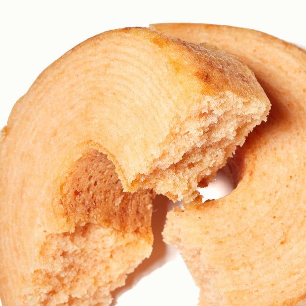 A Taiyo Foods Mini Baumkuchen: Strawberry with a bite taken out of it.