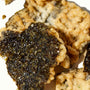 A piece of Ohgiya Noriten Seaweed Tempura Chips: Wasabi on a white plate. thumbnail 2