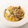 A plate of spaghetti with Kikkoman Hon Tsuyu Soup Base mushrooms and peas. thumbnail 5