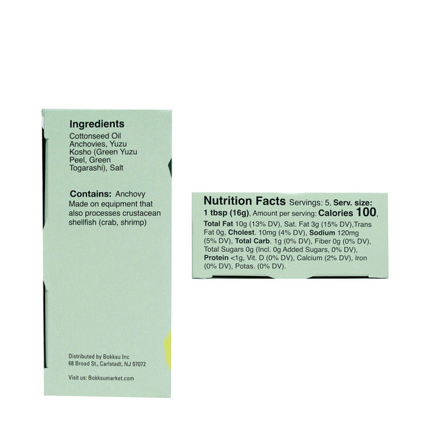 Ingredients and Nutrition Facts label for Bokksu Tinned Shirasu Anchovies with Yuzu Pepper (2-Pack) containing cotoseed oil, high in protein shirasu anchovies, yuzu kosho, and various seasonings. Serving size: 1 tbsp (16g). Contains 100 calories per serving. Brand Name: Bokksu