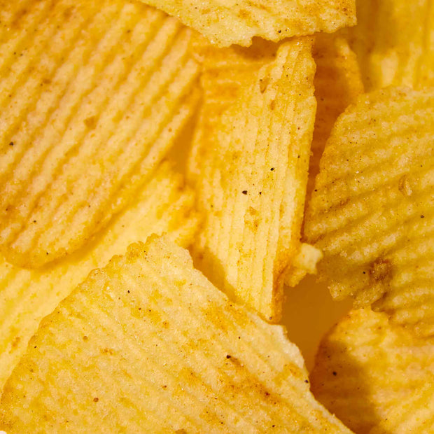 A close up of Lay's Potato Chips: Tokyo Yakitori Grilled Chicken on a white plate.