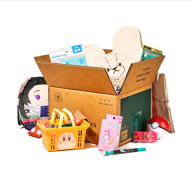 The Holiday Gift Pack from Bokksu is filled with Japan's cutest items, including plush toys, top-notch stationery, snacks, a shopping basket, a Poké Ball, and medical supplies.