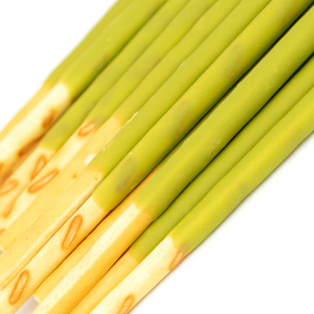 A bunch of Glico Pocky: Matcha Green Tea sticks on a white background.