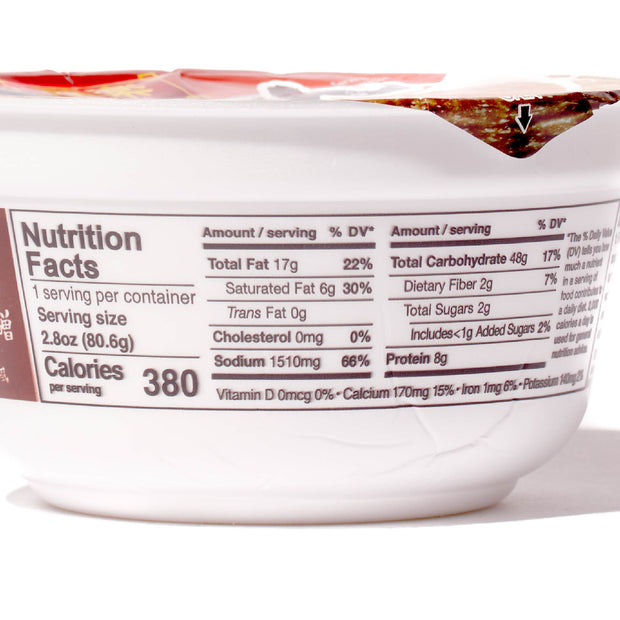 A cup of Hikari Menraku Ramen Bowl: Spicy Miso Tonkotsu yogurt with a label on it.