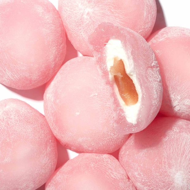 A close up of a Kubota Daifuku Mochi: Ringo Apple with a hole in it.