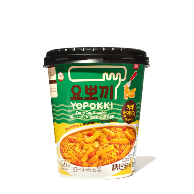 A cup of Yopokki Instant Rabokki Ramen and Tteokbokki Rice Cake Cup: Curry on a white background.