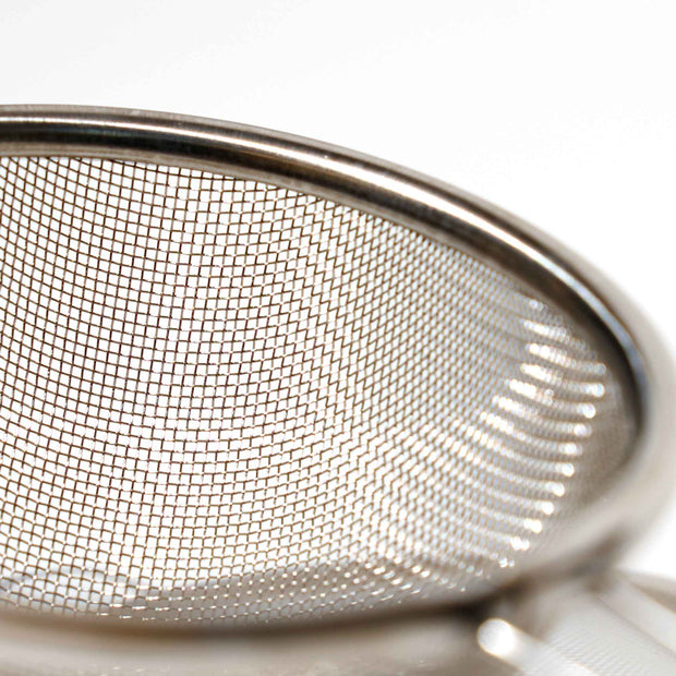 An Aiya Hand Sifter on a white surface.