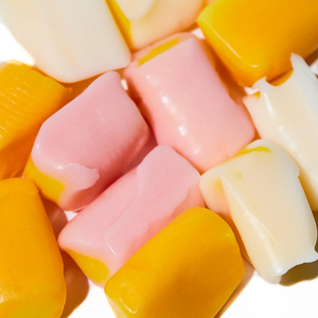 Assorted chewy candies in Morinaga Hi-Chew Large Stand Bag: Fruit Combo Double Layered Tropical flavor and pastel colors.