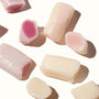 A group of Morinaga Hi-Chew: Yogurt Mix candy pieces on a white surface. thumbnail 2