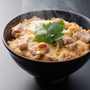 A bowl of Kikkoman Hon Tsuyu Soup Base with meat in it. thumbnail 6